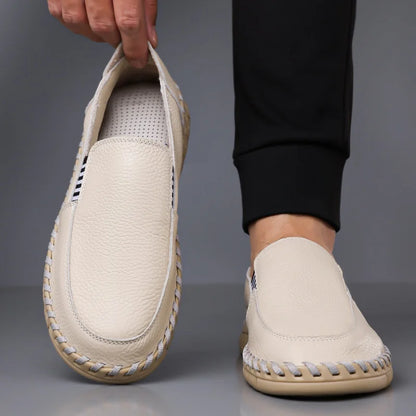 Merrick Leather Driving Mocs in cream, angled view